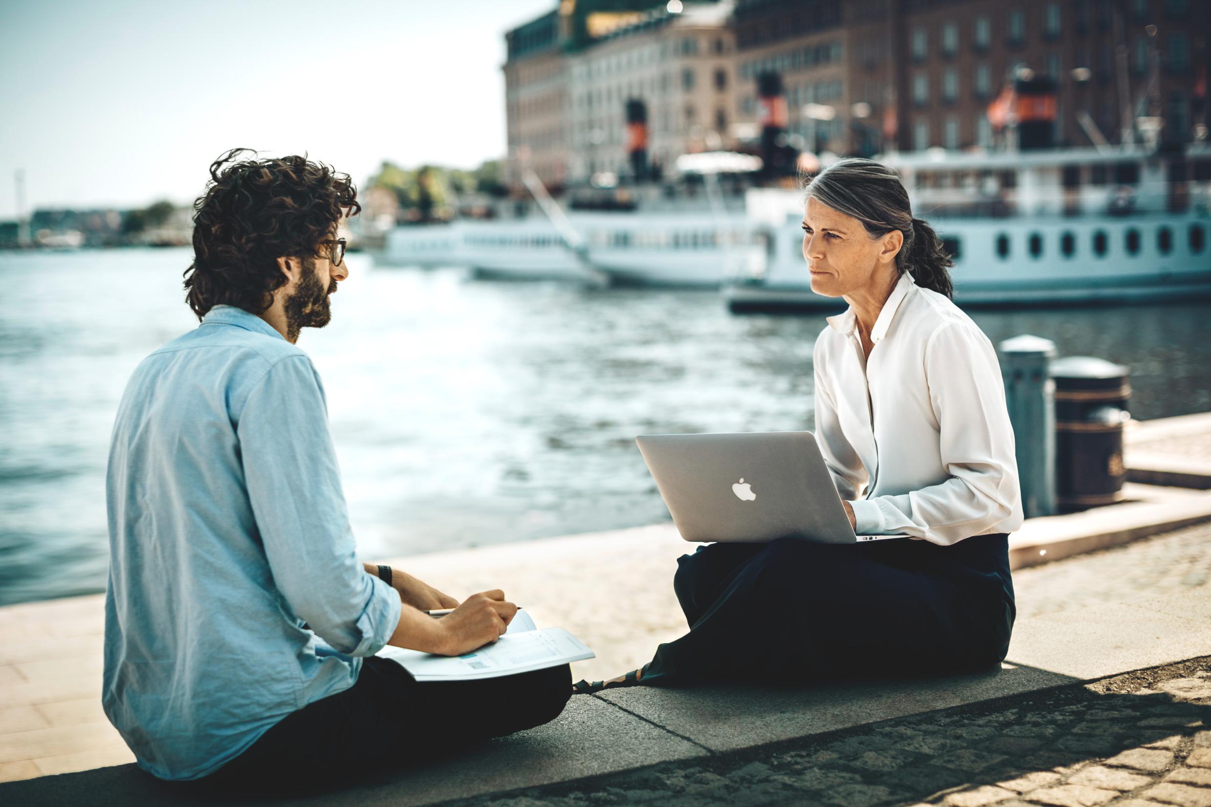 Man and woman working on a quay in the city center of Stockholm